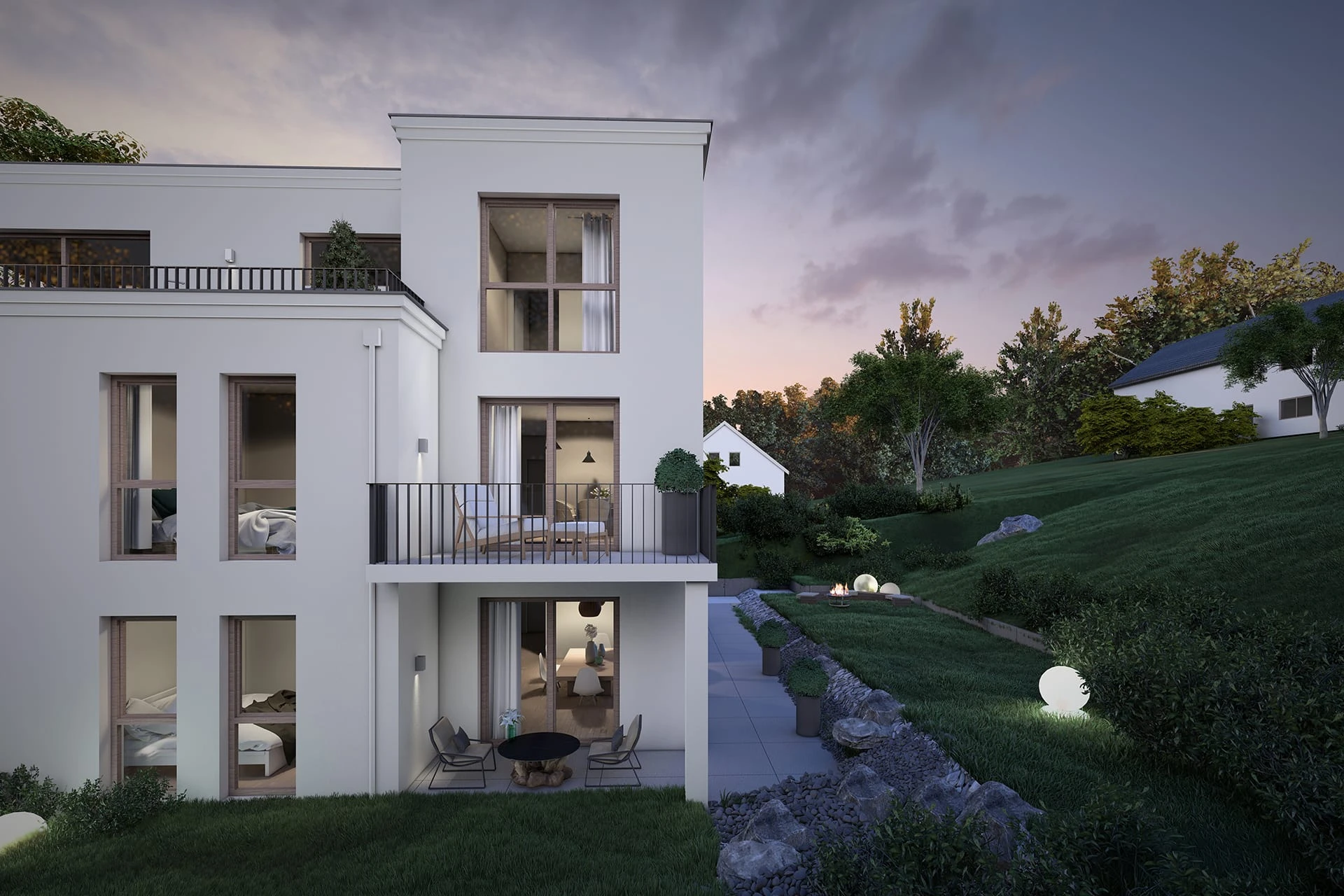 Hochwertiges Neubau-Wohnhaus in Abendstimmung mit beleuchteten Fenstern und Gartenanlage
